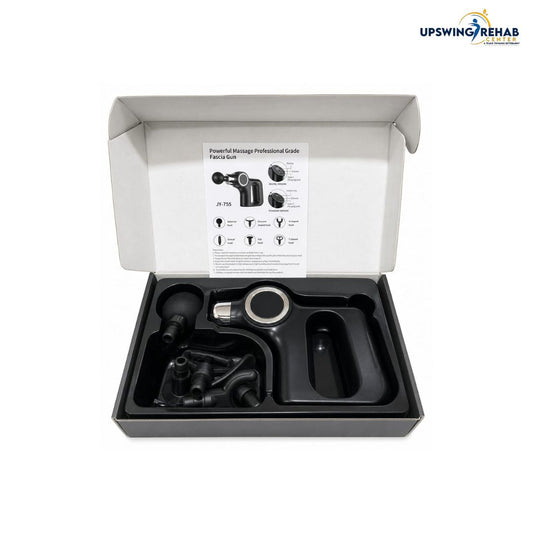 An open white product box displaying a professional-grade massage gun kit with its black foam cover removed, showing included accessories and an instruction insert. The UPSWING REHAB logo is visible in the top right corner.